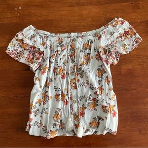 ‘No Boundaries’ white off the shoulder floral blouse.